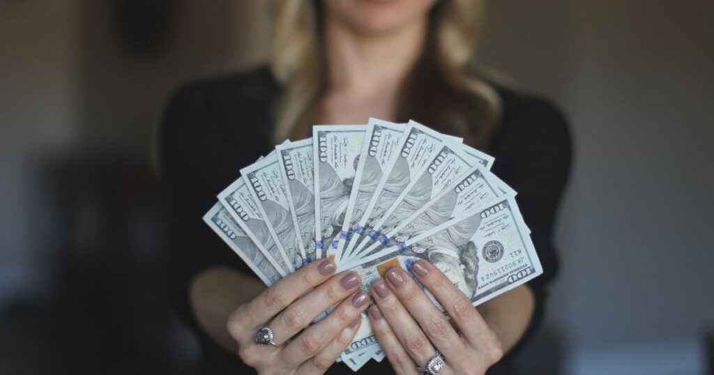 real estate broker holding cash