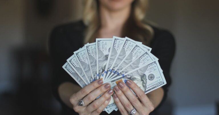real estate broker holding cash